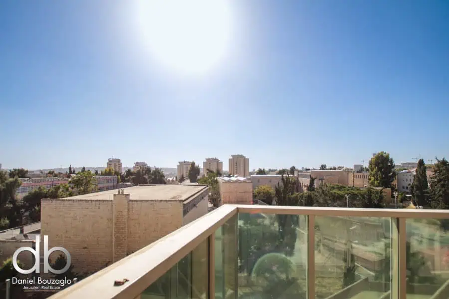 Bright Jerusalem city view from balcony in a modern apartment, showcasing scenic skyline and vibrant urban landscape, ideal for real estate investment or property buyers in Jerusalem.