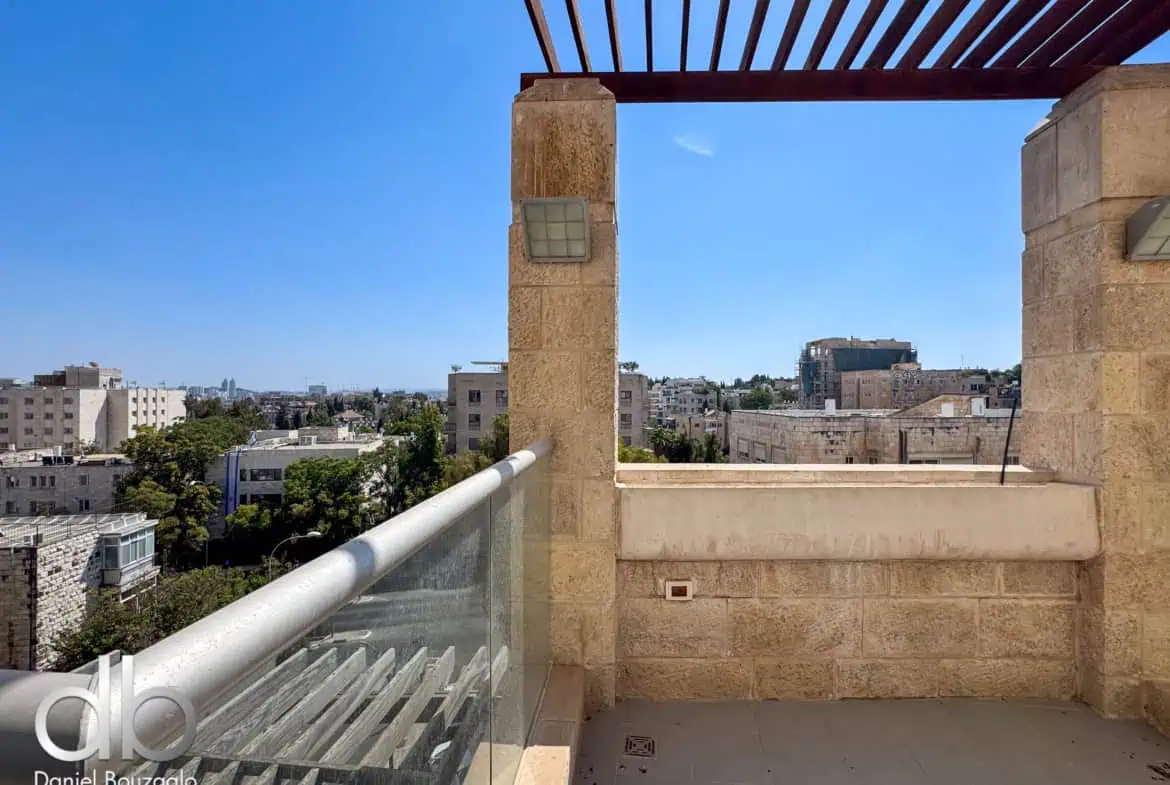 Modern Jerusalem real estate balcony with city view, stone accents, and glass railings, perfect for upscale residential properties.
