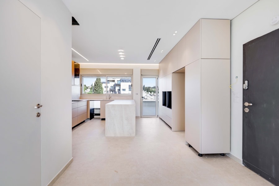 Harakevet rd duplex penthouse for sale 15_1 Spacious modern Jerusalem real estate interior with minimalist design, large windows, and city views for luxury property buyers.