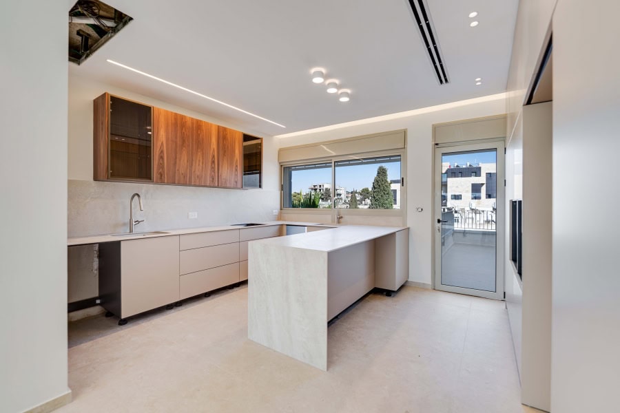 Harakevet rd duplex penthouse for sale 16_1 | Daniel Bouzaglo - Jerusalem Real Estate Modern Jerusalem real estate kitchen with minimalist design, natural light, and contemporary finishes for stylish living.