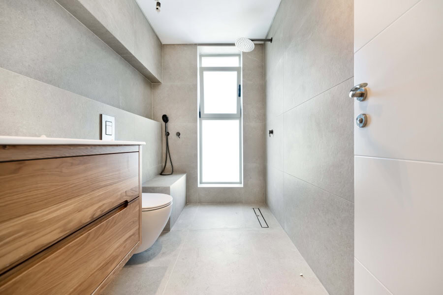 Harakevet rd duplex penthouse for sale 1_1 Modern Jerusalem bathroom with minimalist design, neutral tones, natural light, and contemporary fixtures, showcasing upscale Jerusalem real estate.