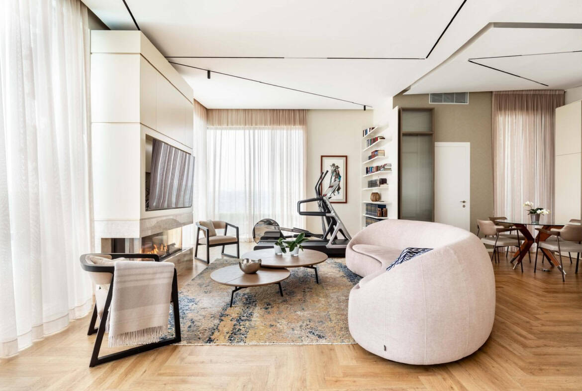 Bright Jerusalem apartment living space with contemporary furniture, hardwood floors, and scenic views.