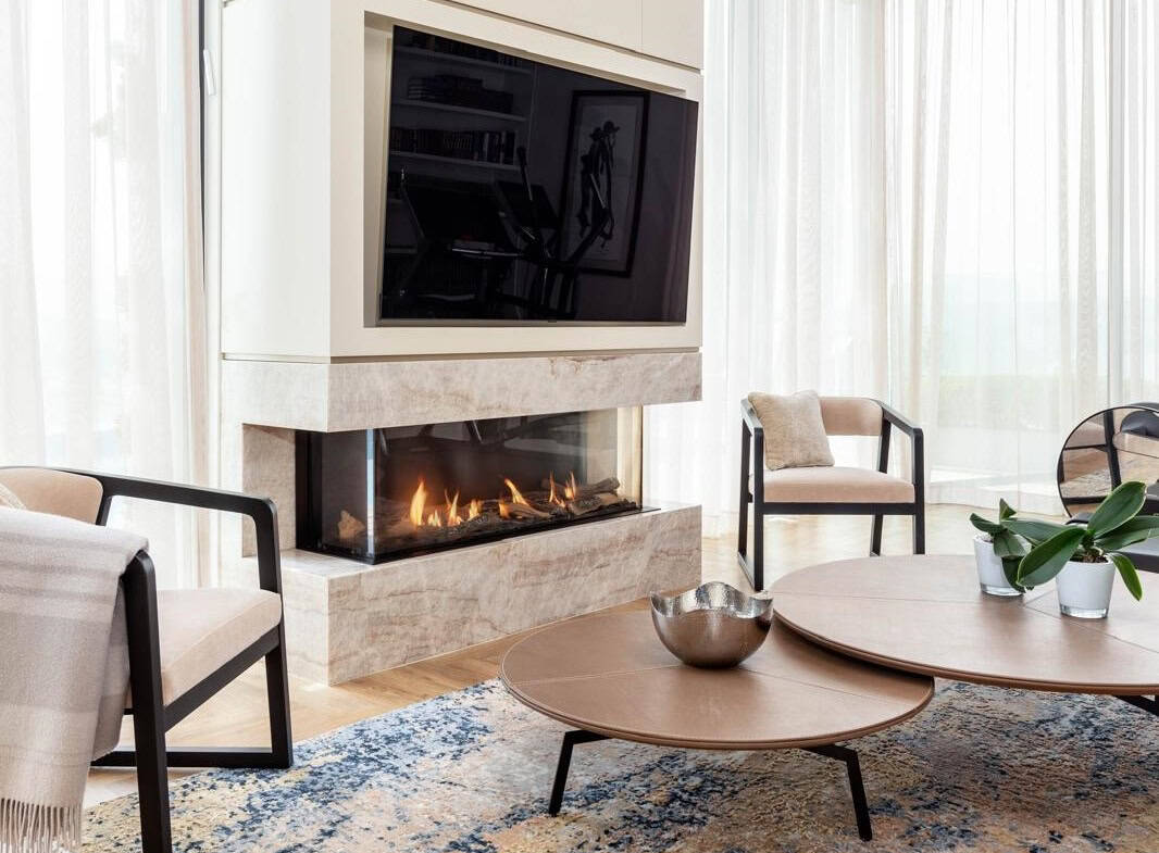 Luxury Jerusalem real estate interior with modern fireplace, elegant furniture, and bright natural light, perfect for sophisticated living.