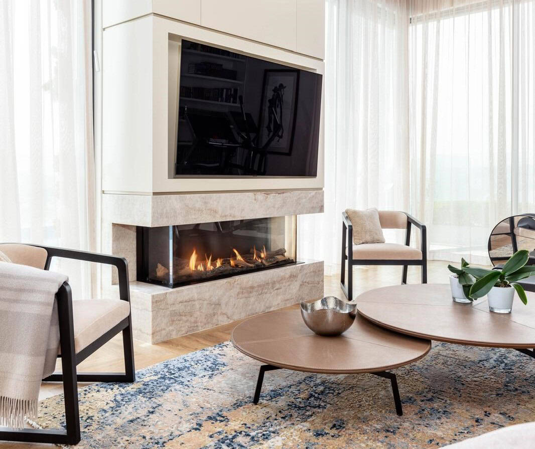 Modern Jerusalem real estate living room with fireplace and stylish decor, showcasing luxury interior design. Luxury Jerusalem real estate interior with modern fireplace, elegant furniture, and bright natural light, perfect for sophisticated living.